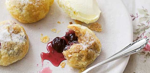 Lime iced tea with cherry & blueberry Eccles cakes
